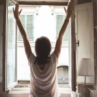 girl opening a window
